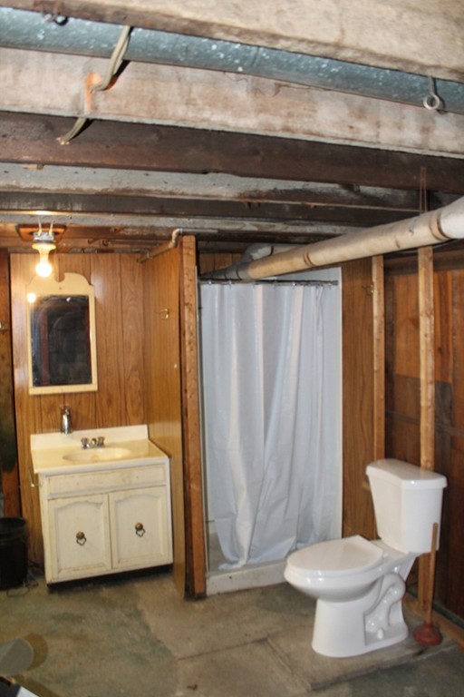 18-20 Howes Street Springfield, MA 01118 - Photo 29 of 30 a bathroom with a sink and a mirror