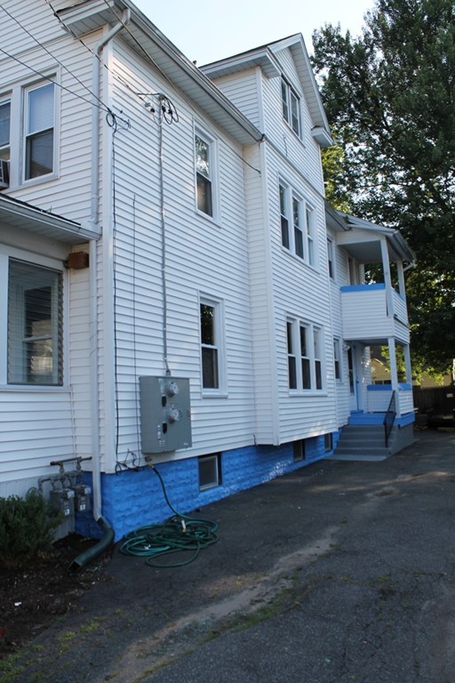 18-20 Howes Street Springfield, MA 01118 - Photo 3 of 30 a front view of a house with a yard