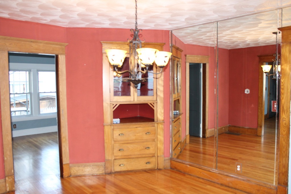 18-20 Howes Street Springfield, MA 01118 - Photo 9 of 30 a view of a room with wooden floor