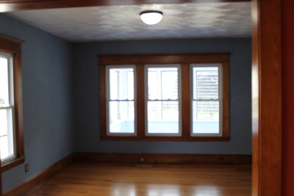 18-20 Howes Street Springfield, MA 01118 - Photo 10 of 30 an empty room with wooden floor and windows