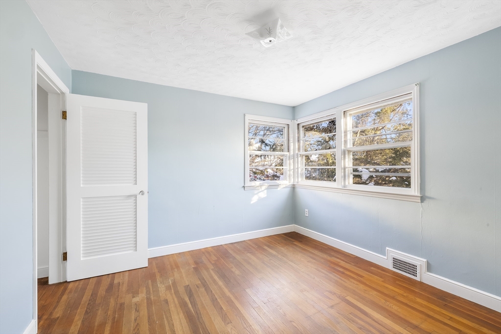 432 Mower Street Worcester, MA 01602 - Photo 11 of 16 a view of empty room with wooden floor and fan
