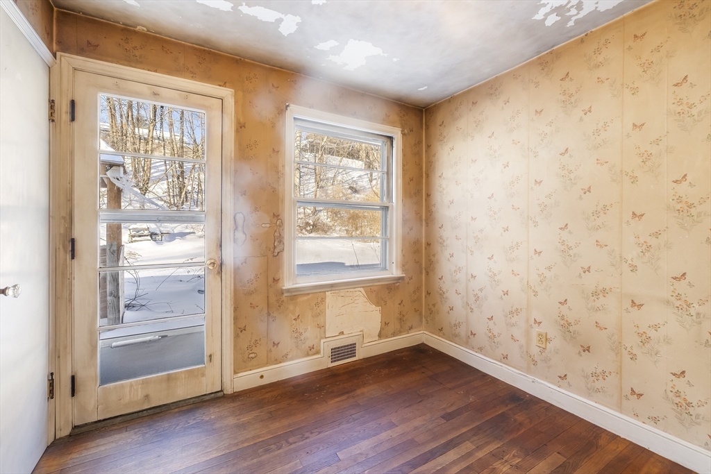 432 Mower Street Worcester, MA 01602 - Photo 9 of 16 a view of an empty room with wooden floor and a window