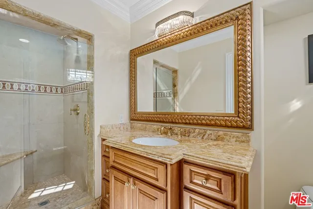 a bedroom with a bed and flat screen tv