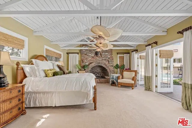 an aerial view of a house with a yard swimming pool and outdoor seating