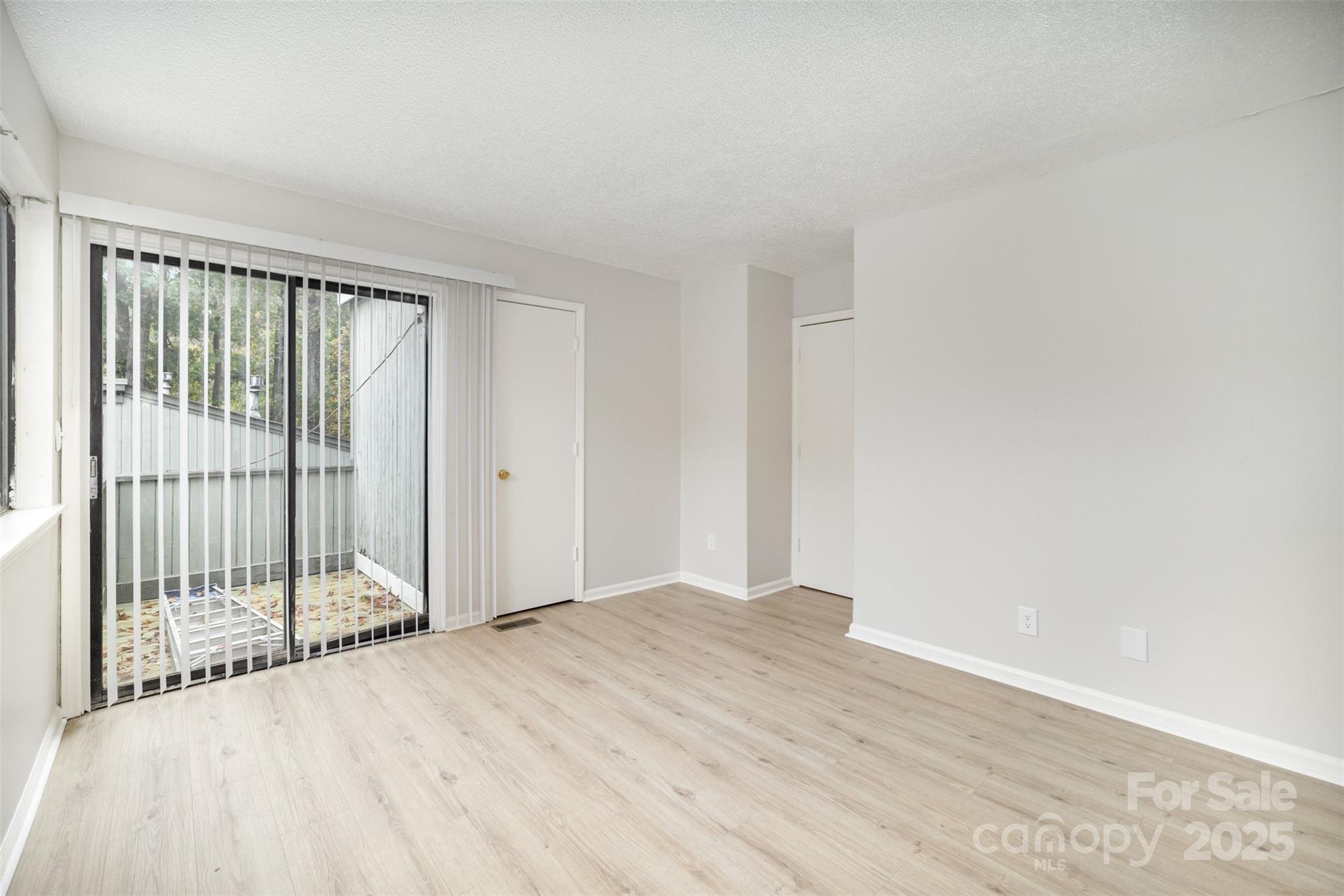 6128 Bent Tree Court Charlotte, NC 28212 - Photo 11 of 16 a view of an empty room with wooden floor