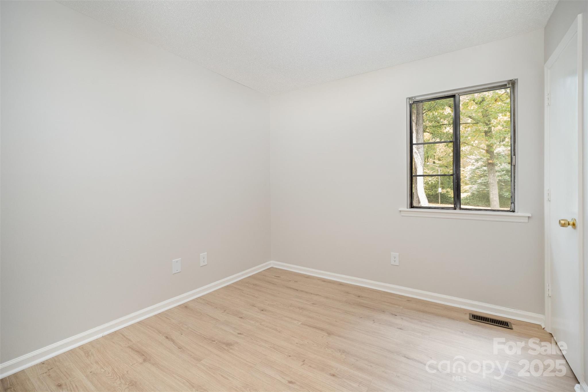 6128 Bent Tree Court Charlotte, NC 28212 - Photo 13 of 16 an empty room with a window