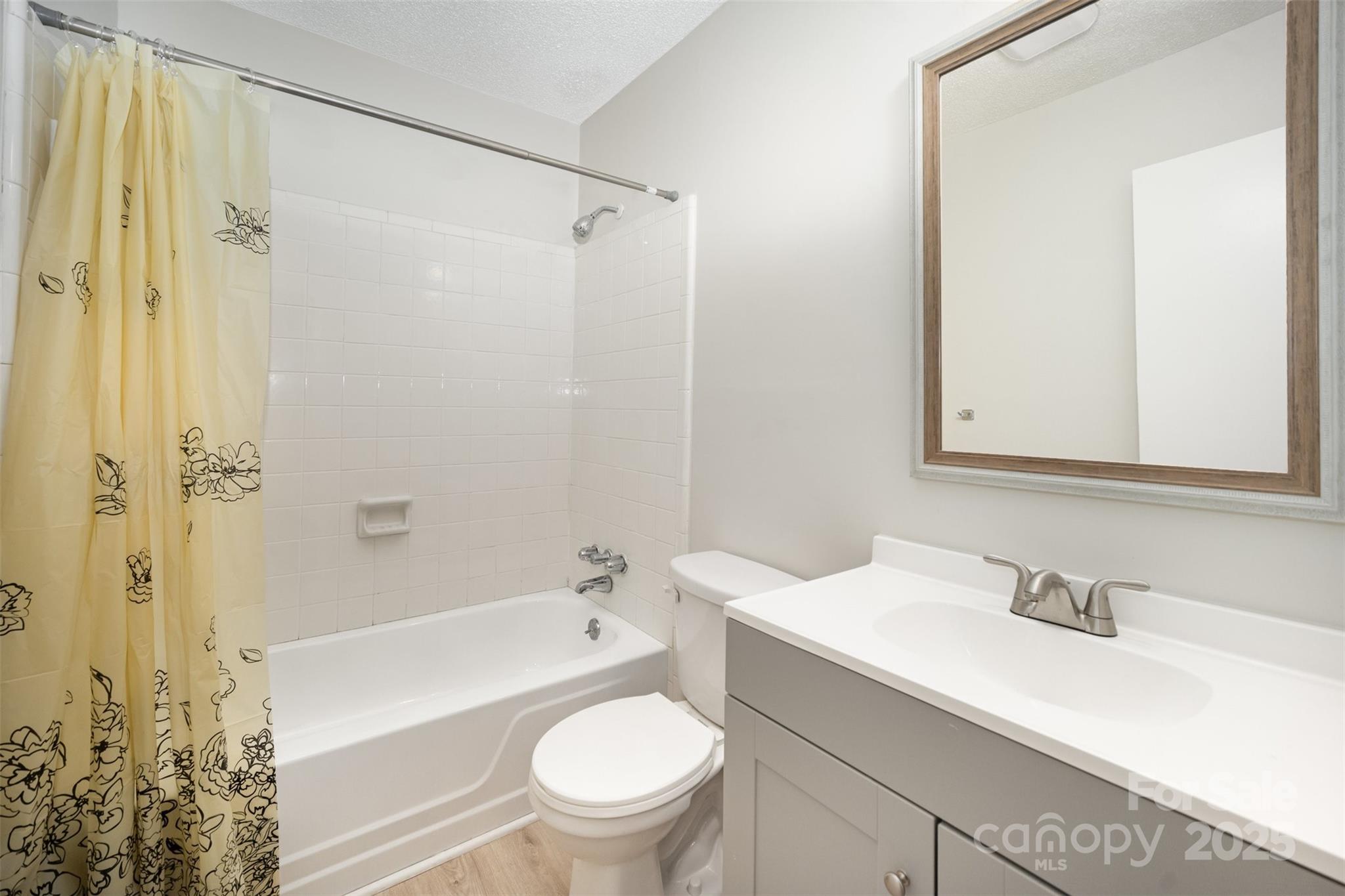 6128 Bent Tree Court Charlotte, NC 28212 - Photo 16 of 16 a bathroom with a sink toilet vanity and shower