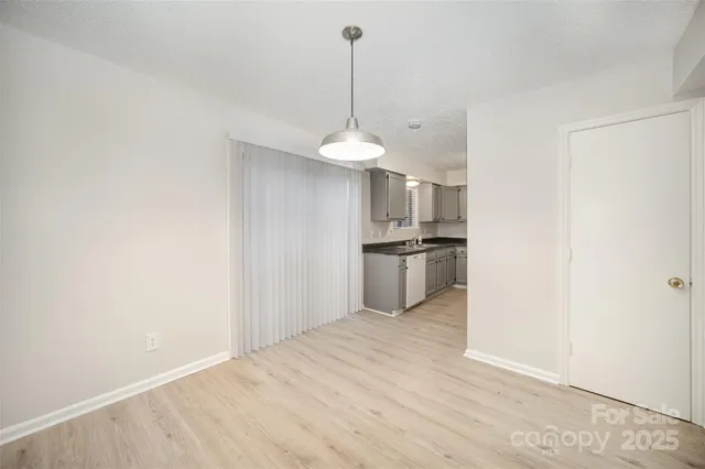 a kitchen with stainless steel appliances a refrigerator and a sink