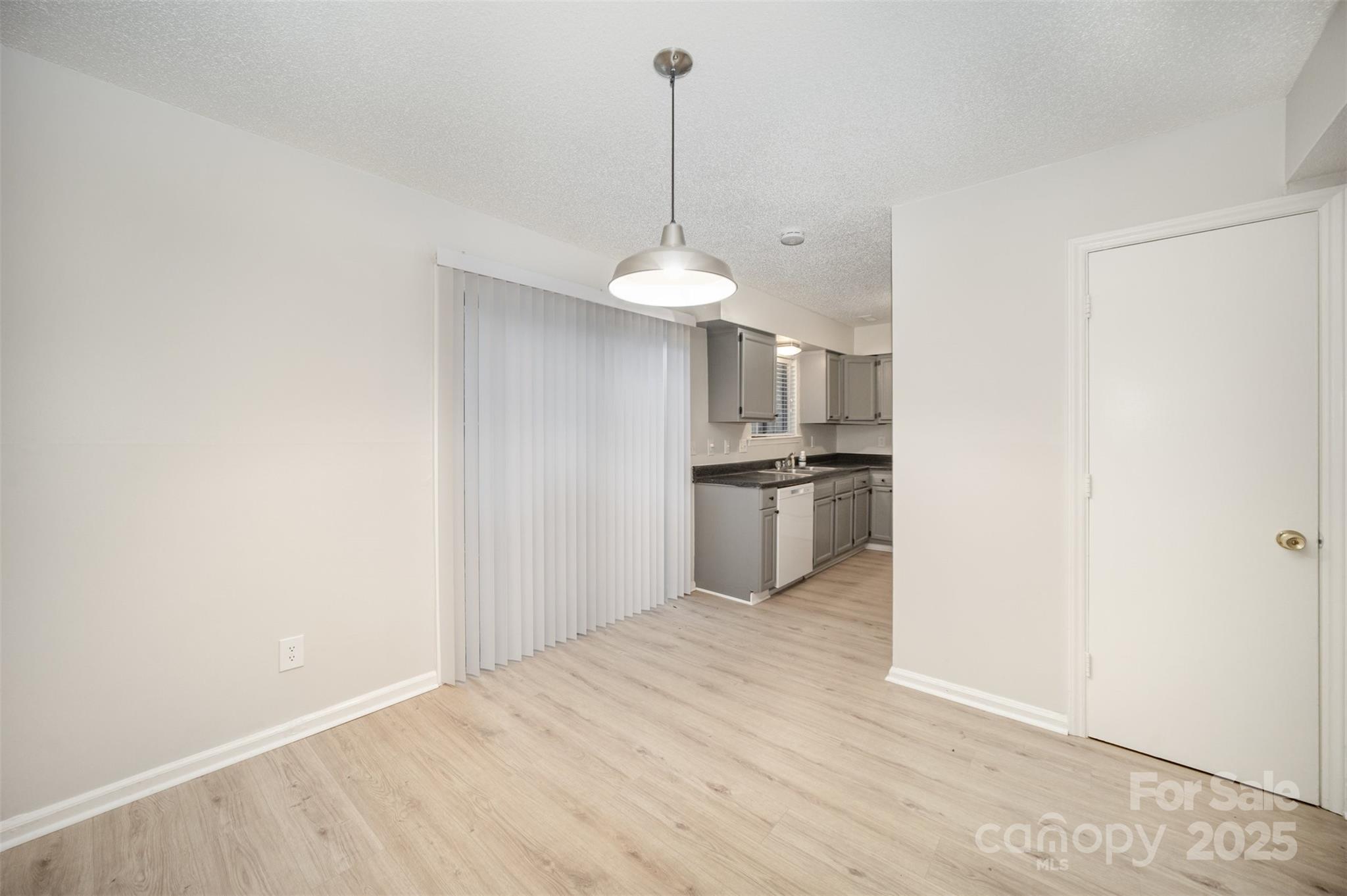 6128 Bent Tree Court Charlotte, NC 28212 - Photo 4 of 16 a kitchen with stainless steel appliances a refrigerator and a sink