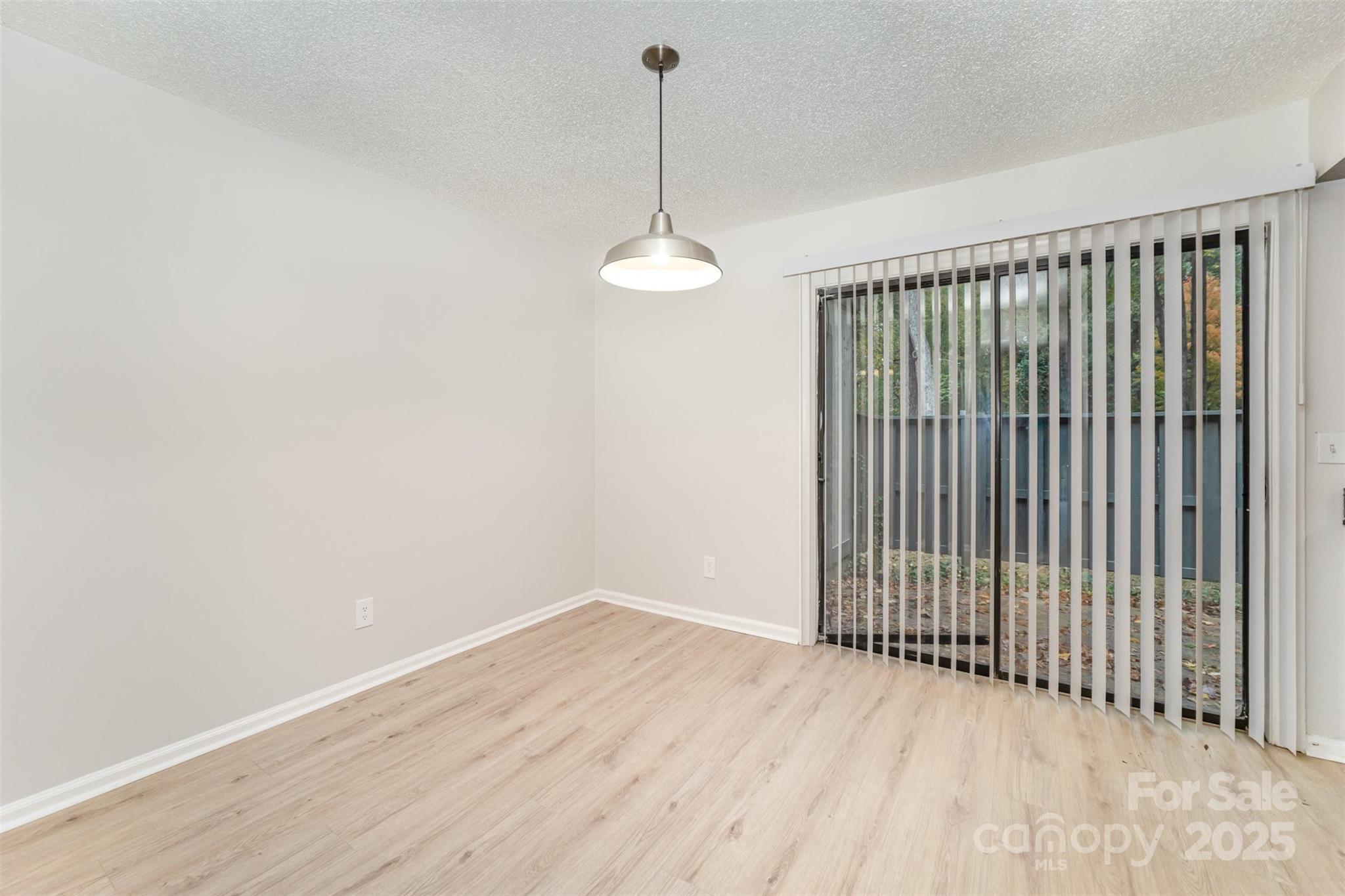 6128 Bent Tree Court Charlotte, NC 28212 - Photo 5 of 16 a view of a room with wooden floor