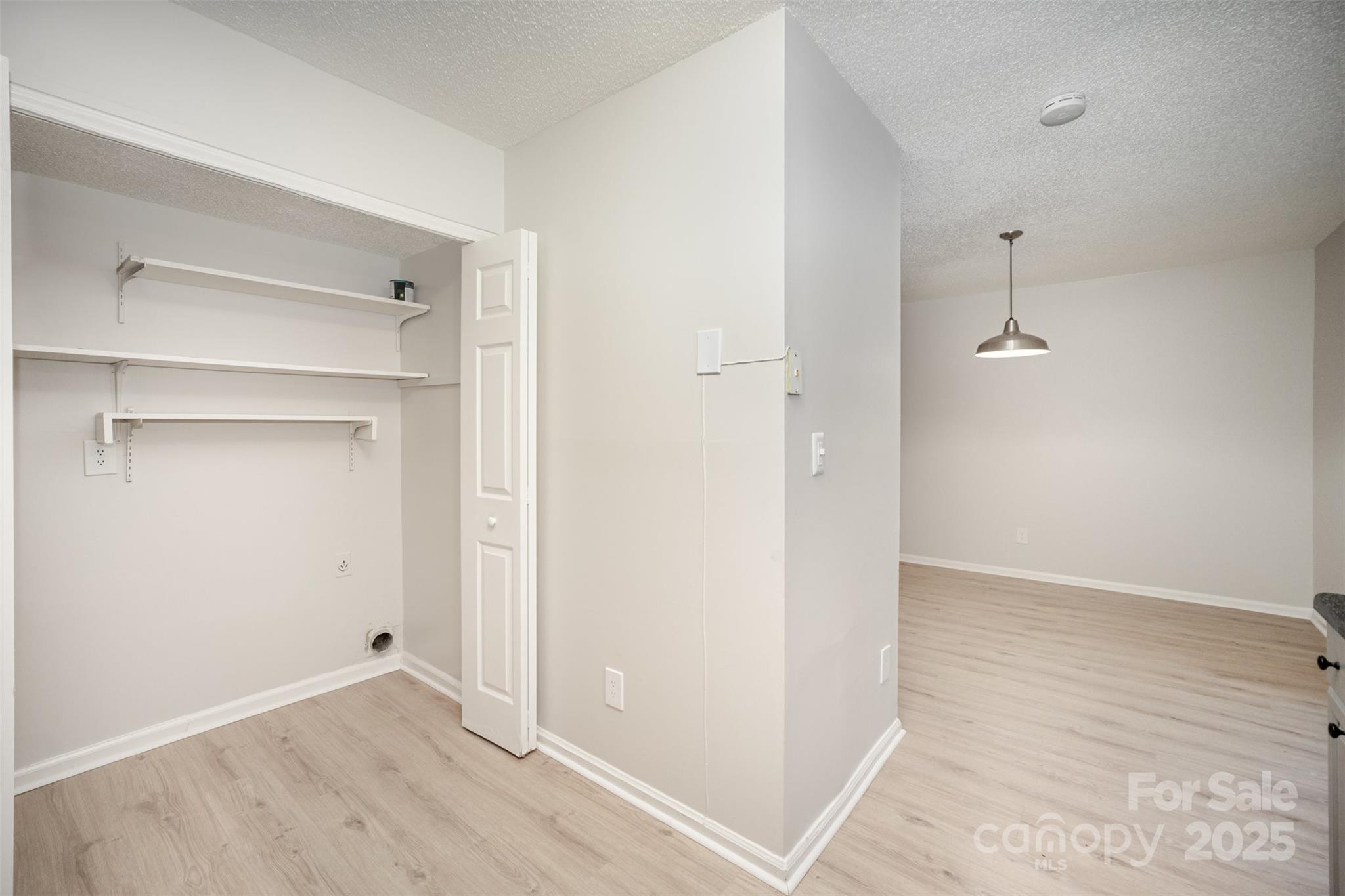 6128 Bent Tree Court Charlotte, NC 28212 - Photo 9 of 16 an empty room with wooden floor and closet