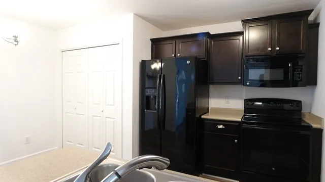 a kitchen with a sink and cabinets