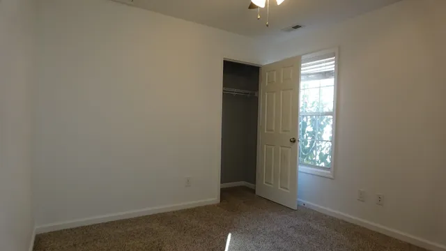 a view of hallway with windows