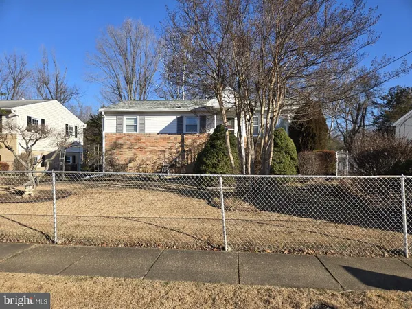 a front view of a house with a basket ball court