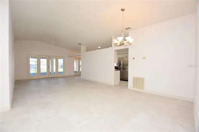 a view of a room with windows and chandelier