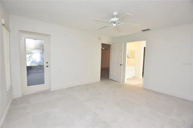 a view of an empty room with a bathroom