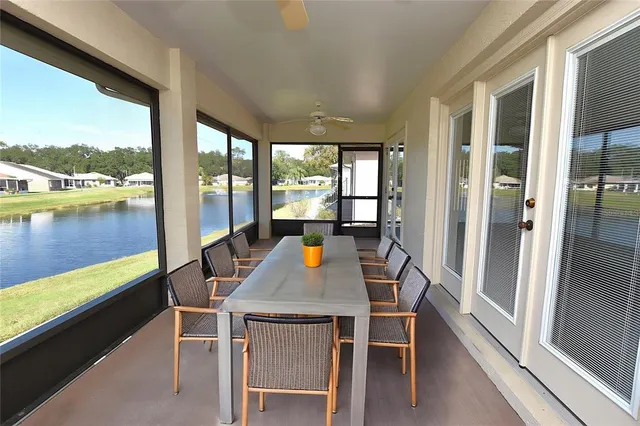 a view of a dining room with furniture and window