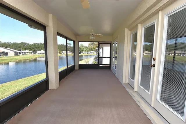 a view of a room with window and wooden floor