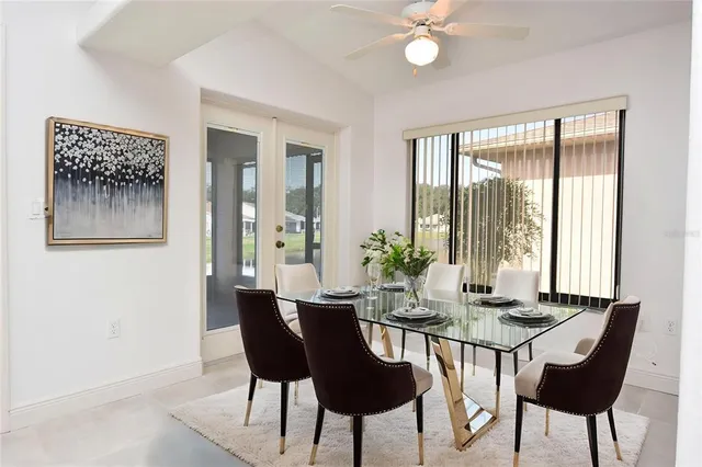 a view of a dining room with furniture and window