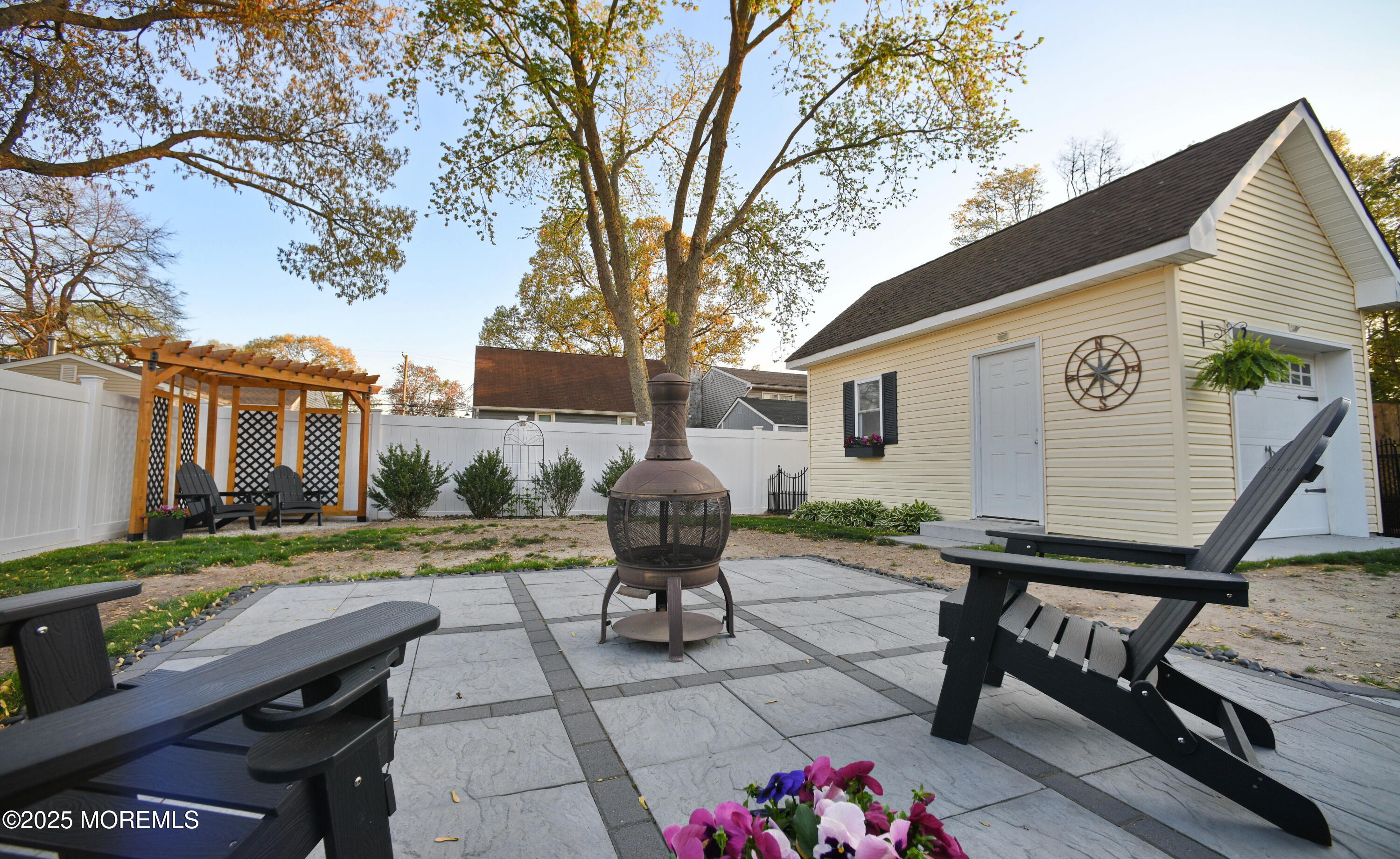 2222 Kenneth Road Point Pleasant, NJ 08742 - Photo 5 of 27 a view of a patio with chair and table and chairs next to a yard