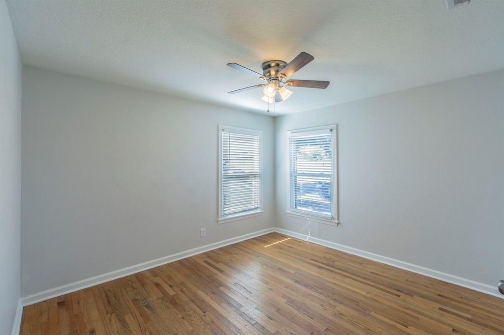 1029 North New Road Waco, TX 76710 - Photo 13 of 26 a view of empty room with wooden floor and fan