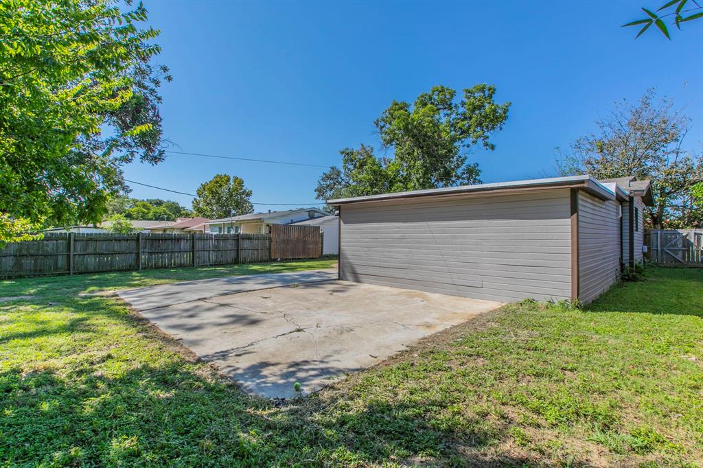 1029 North New Road Waco, TX 76710 - Photo 21 of 26 a view of backyard with plants and trees