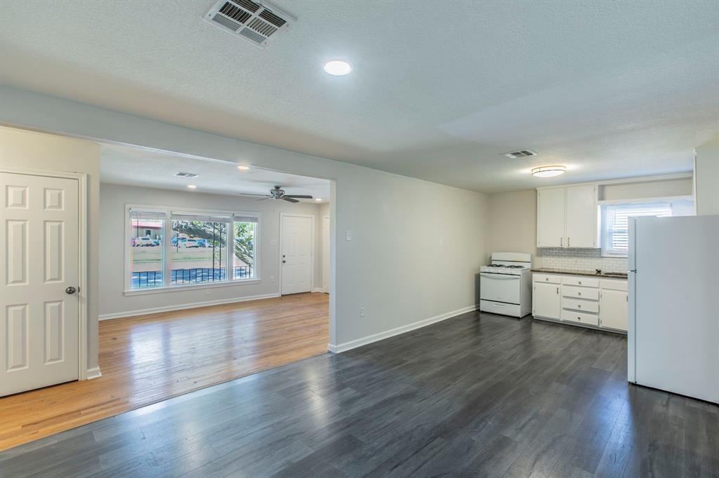 1029 North New Road Waco, TX 76710 - Photo 8 of 26 a view of kitchen with stainless steel appliances cabinets and wooden floor