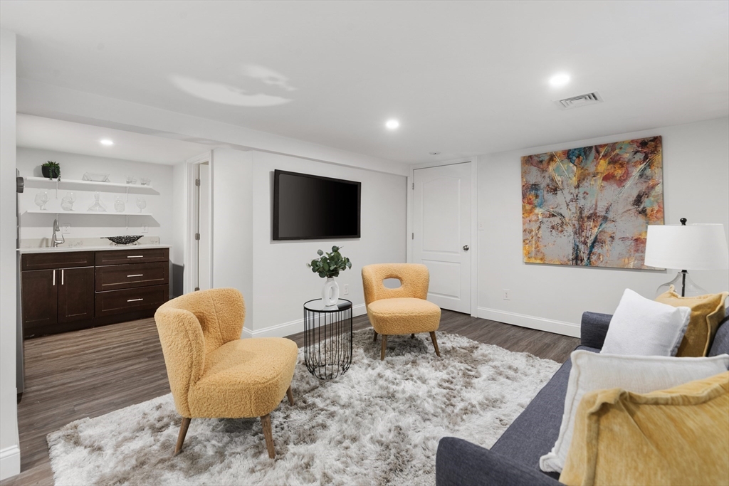 47 Fuller Road, Unit 47 Watertown, MA 02472 - Photo 15 of 21 a living room with furniture and a flat screen tv