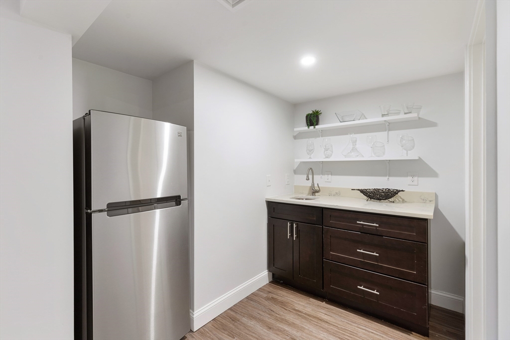 47 Fuller Road, Unit 47 Watertown, MA 02472 - Photo 16 of 21 a kitchen with a refrigerator and a sink
