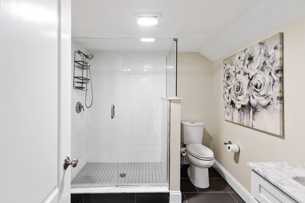 47 Fuller Road, Unit 47 Watertown, MA 02472 - Photo 17 of 21 a bathroom with a toilet and a shower