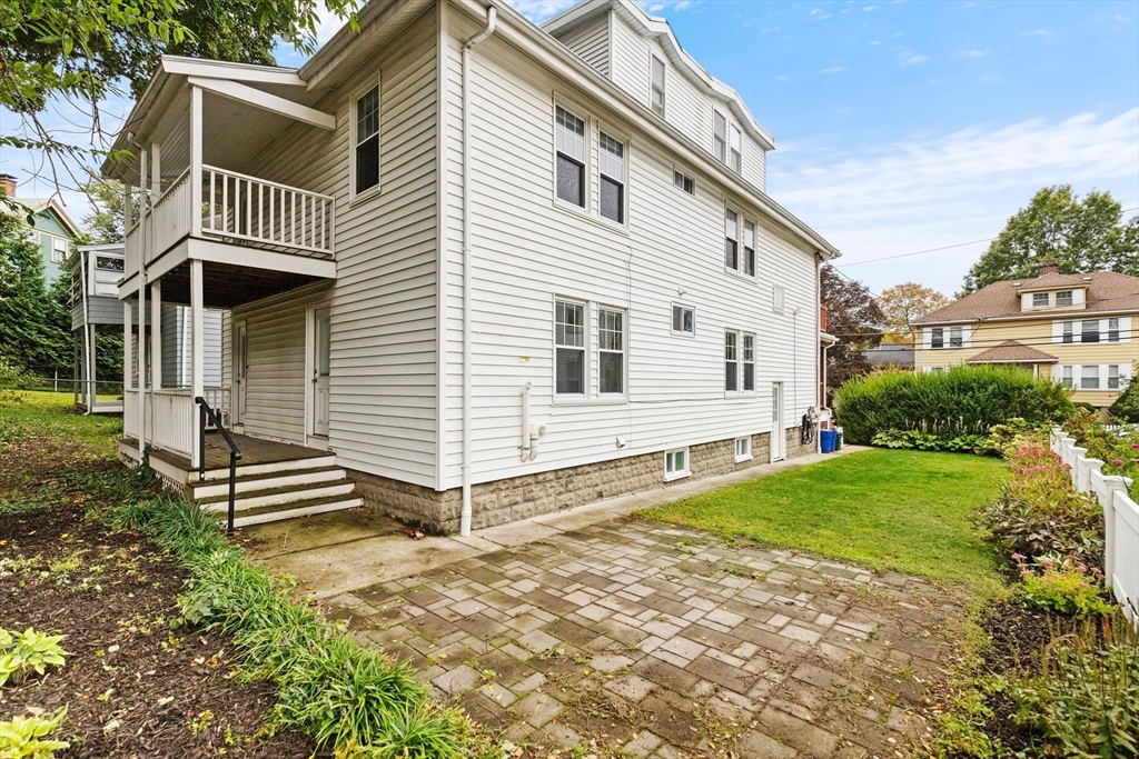 47 Fuller Road, Unit 47 Watertown, MA 02472 - Photo 19 of 21 a front view of a house with a yard