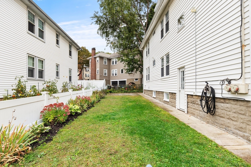 47 Fuller Road, Unit 47 Watertown, MA 02472 - Photo 21 of 21 a house view with a garden space