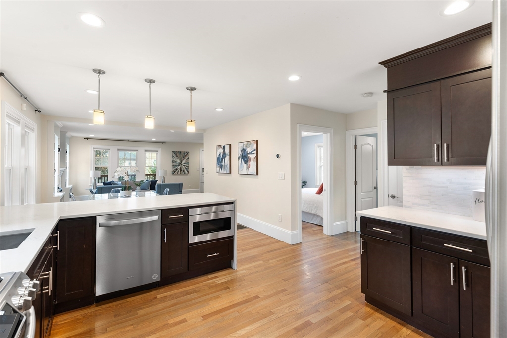 47 Fuller Road, Unit 47 Watertown, MA 02472 - Photo 4 of 21 a kitchen with stainless steel appliances granite countertop a sink a stove and a refrigerator