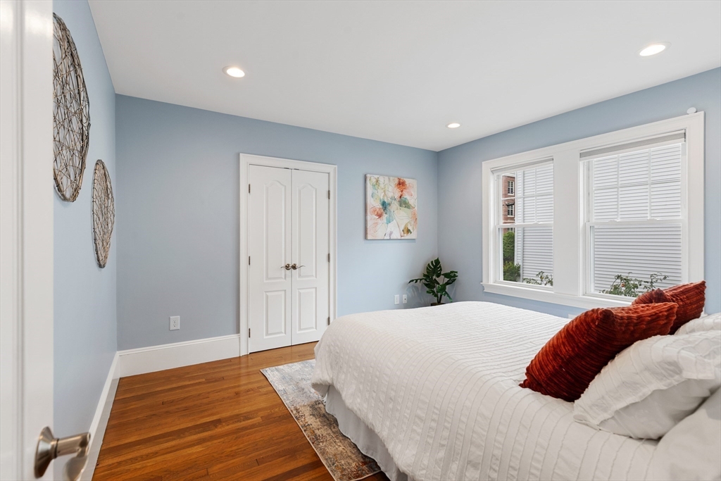 47 Fuller Road, Unit 47 Watertown, MA 02472 - Photo 10 of 21 a bedroom with a bed and a window