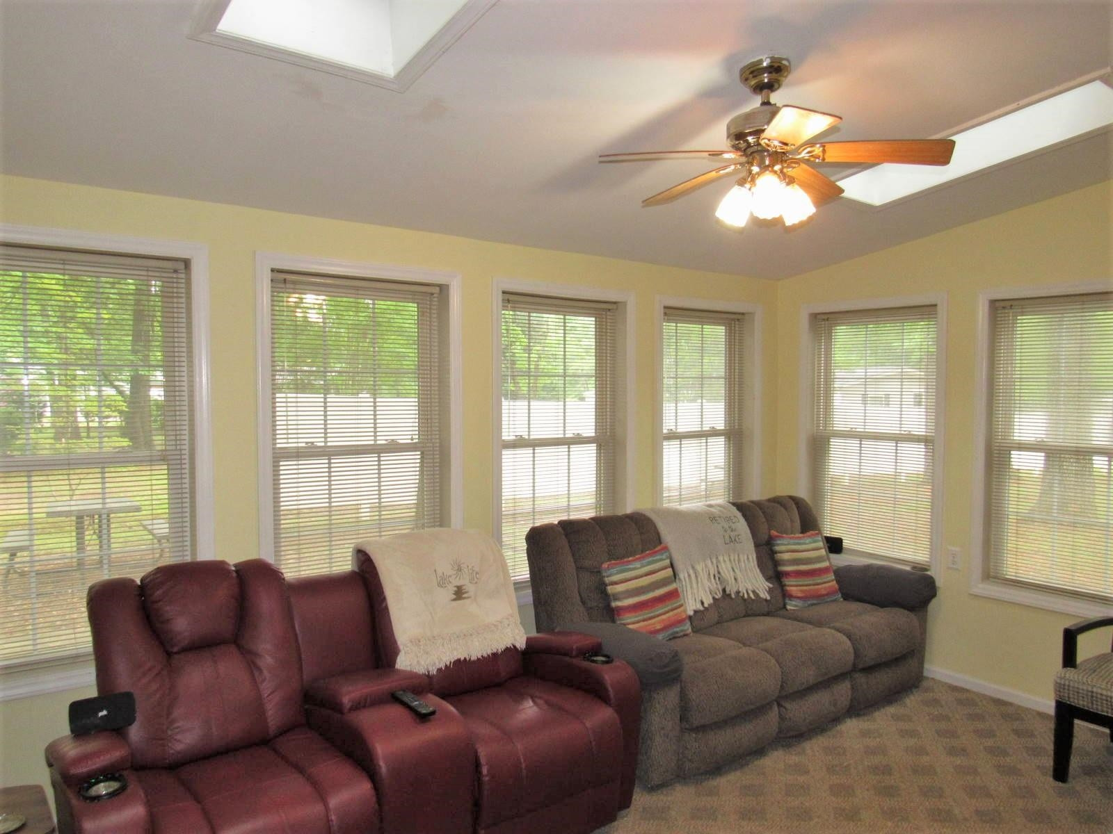 306 Waters Edge Loop Henderson, NC 27537 - Photo 11 of 35 a living room with furniture and a large window