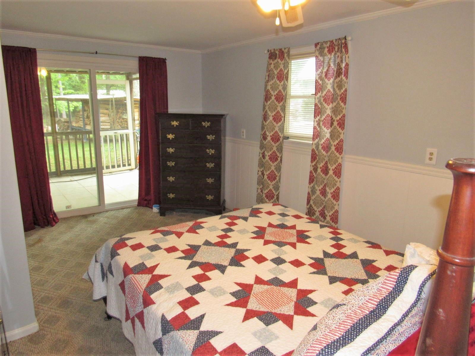 306 Waters Edge Loop Henderson, NC 27537 - Photo 15 of 35 a bedroom with a bed and a window