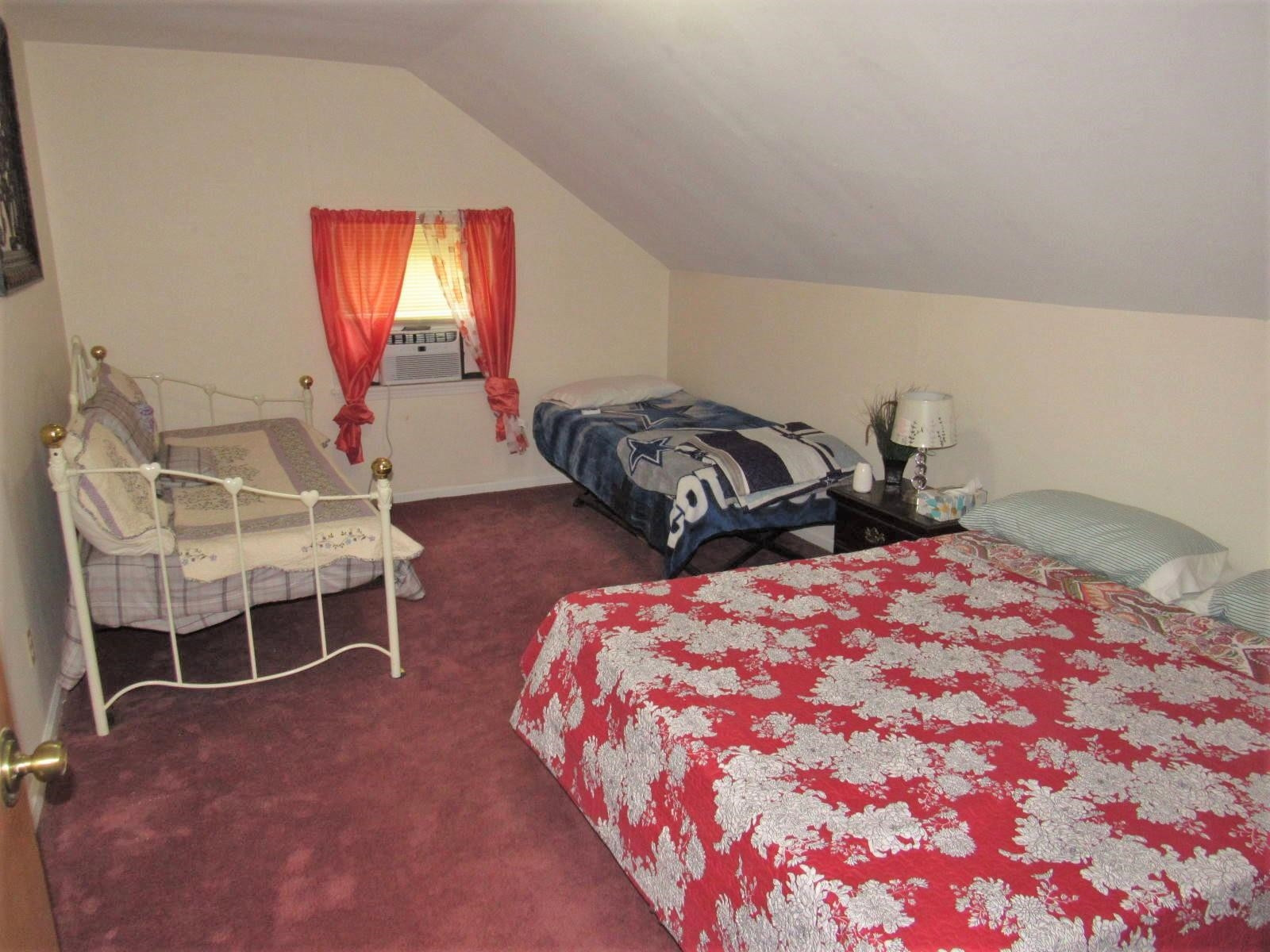 306 Waters Edge Loop Henderson, NC 27537 - Photo 21 of 35 a bedroom with bed and a window