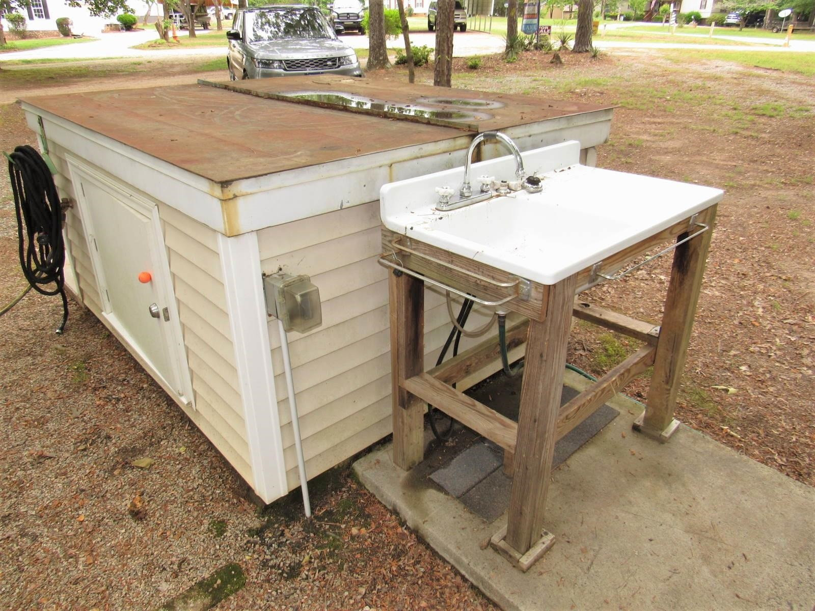 306 Waters Edge Loop Henderson, NC 27537 - Photo 30 of 35 a view of a room that has a table and chairs in it