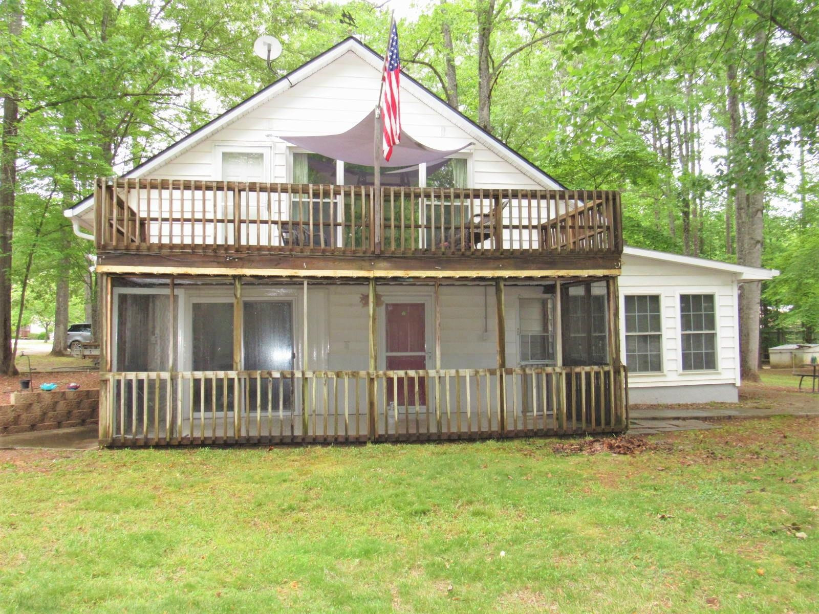 306 Waters Edge Loop Henderson, NC 27537 - Photo 32 of 35 a view of a house with wooden fence