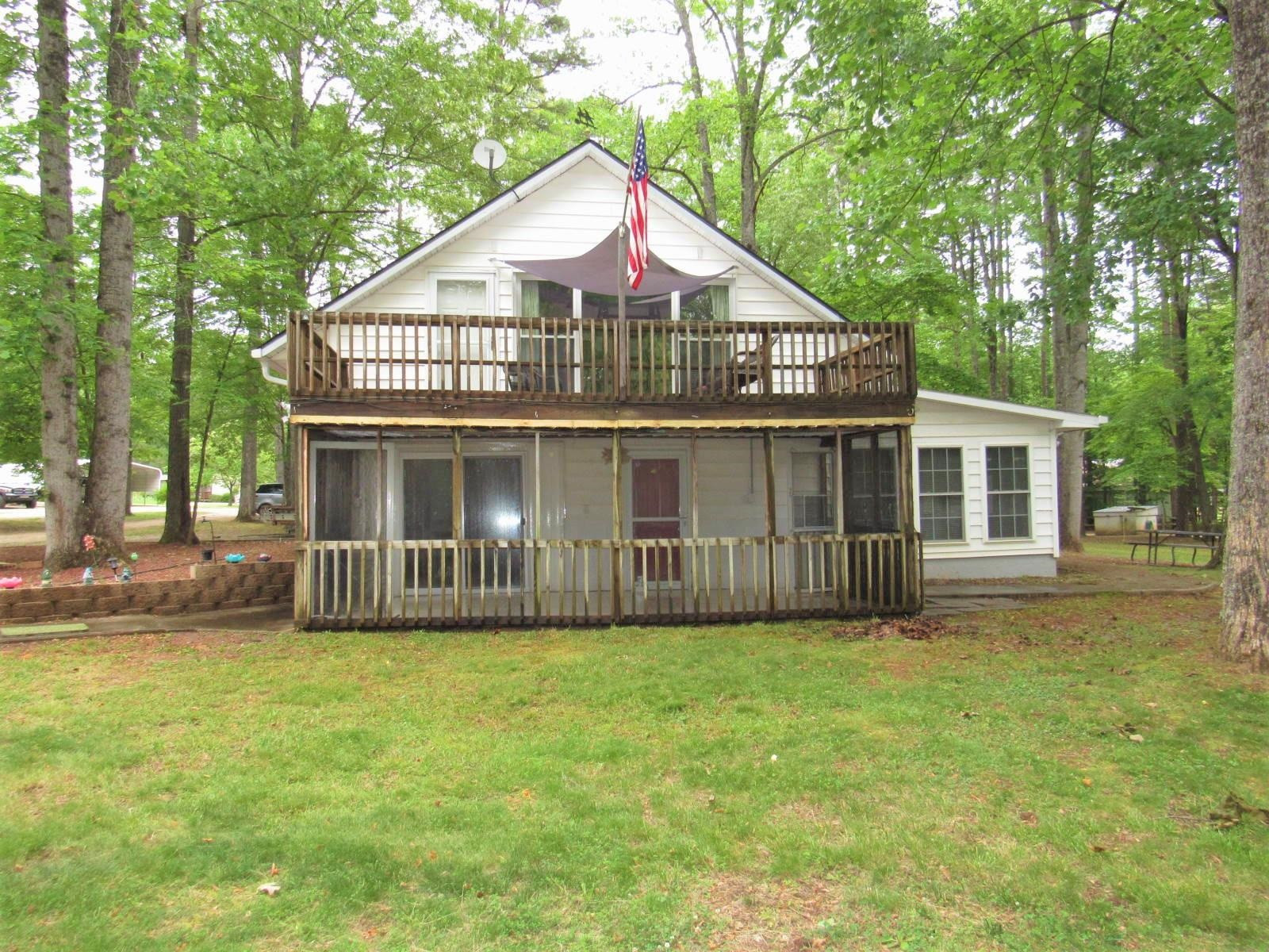306 Waters Edge Loop Henderson, NC 27537 - Photo 4 of 35 a view of front of a house with a yard