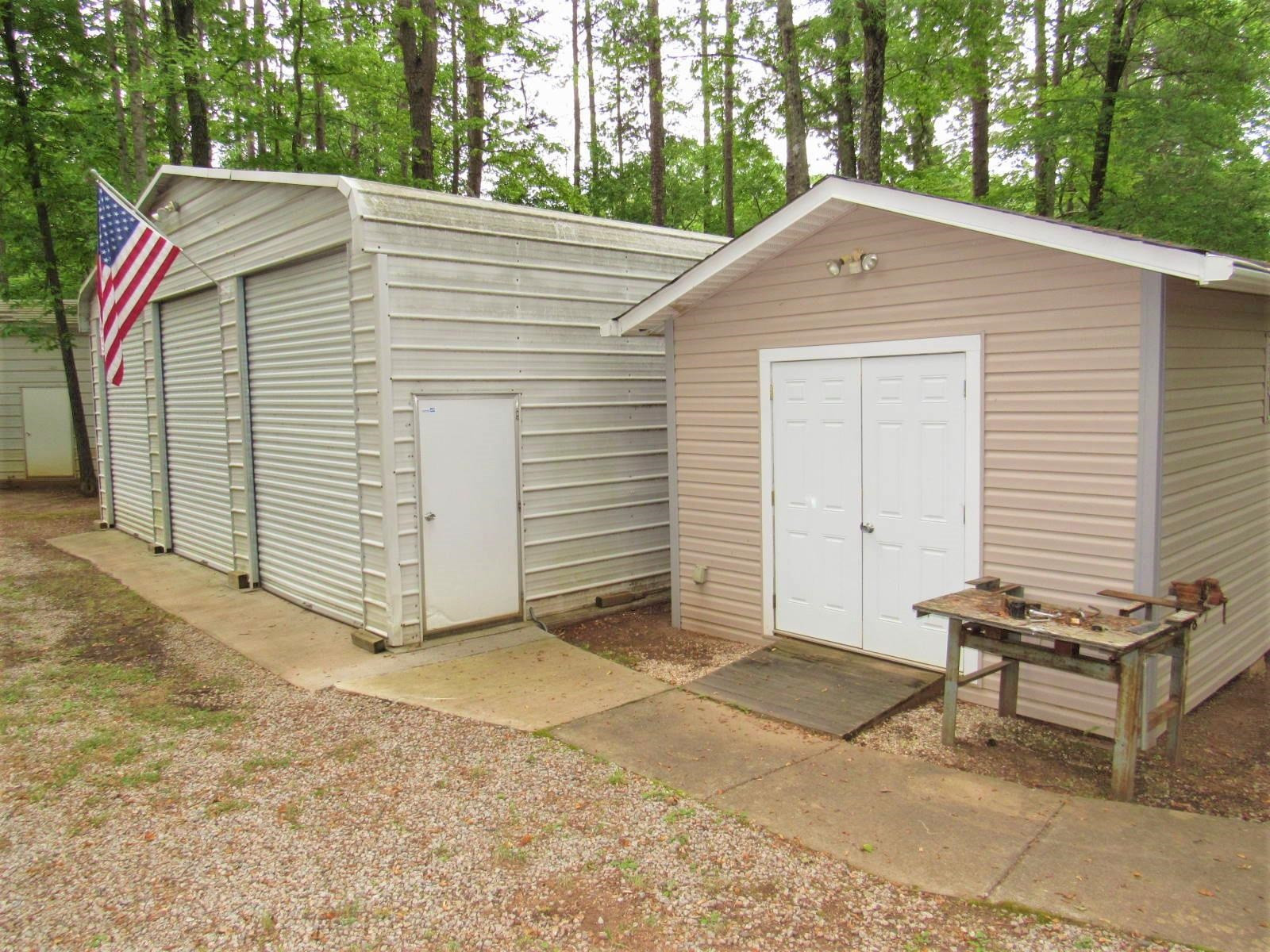 306 Waters Edge Loop Henderson, NC 27537 - Photo 6 of 35 a house with trees in the background