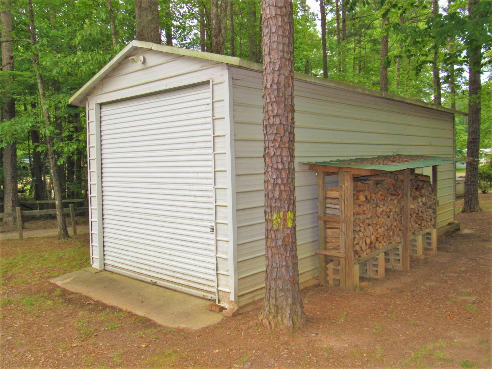 306 Waters Edge Loop Henderson, NC 27537 - Photo 7 of 35 a front view of a house with garage