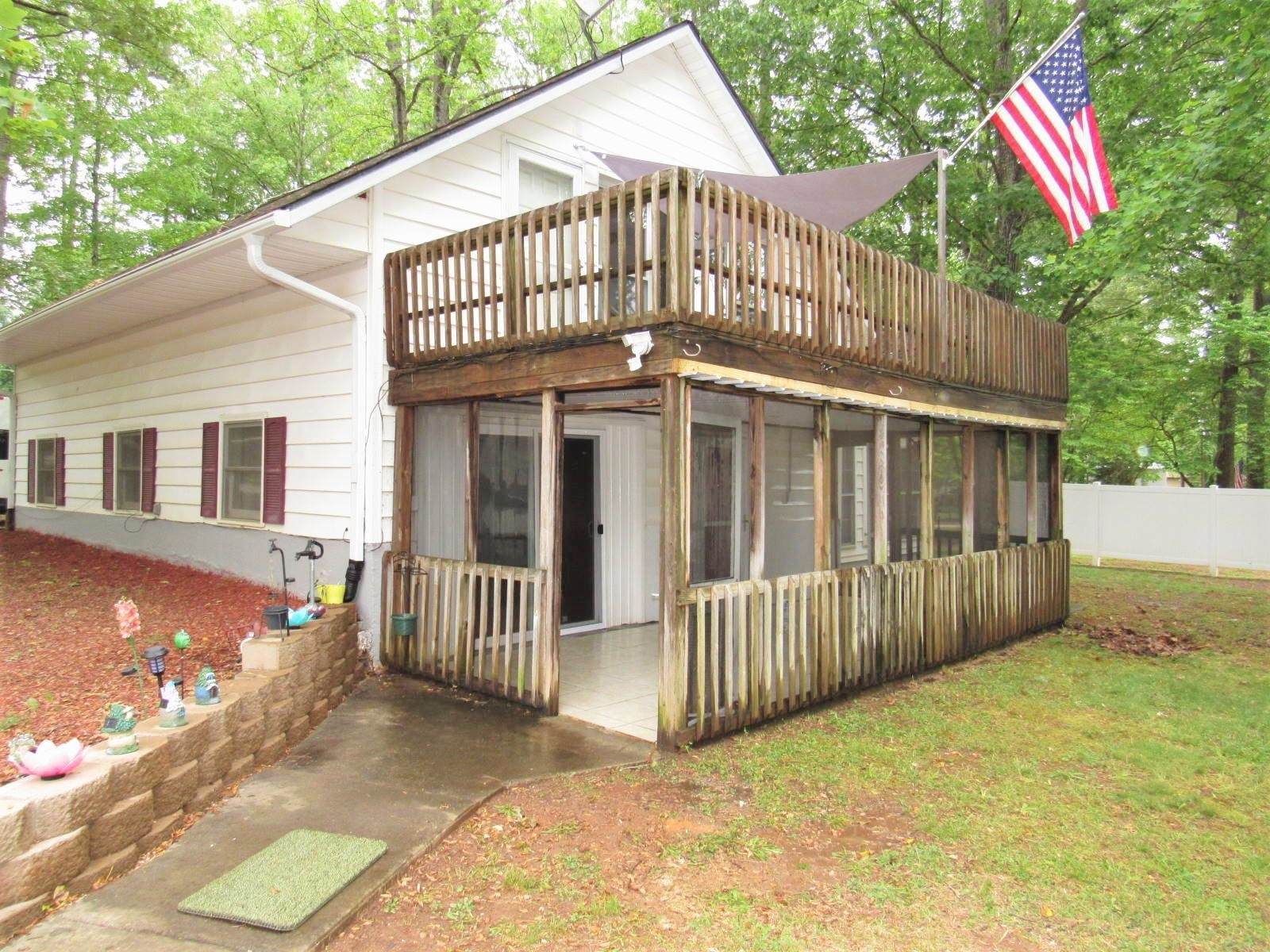 306 Waters Edge Loop Henderson, NC 27537 - Photo 10 of 35 a view of a house with a yard