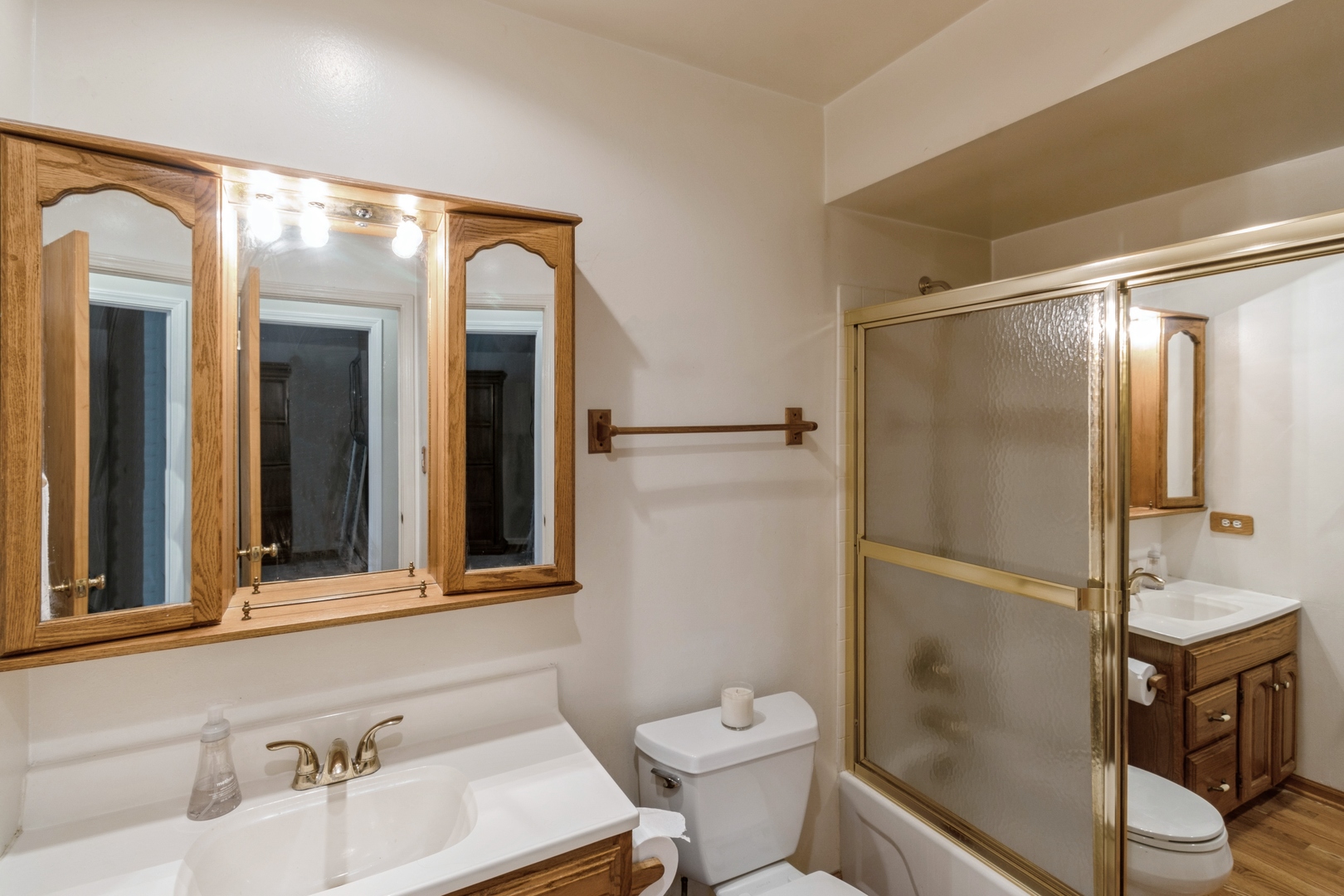 258 Inverrary Lane Deerfield, IL 60015 - Photo 7 of 13 a bathroom with a sink toilet and shower