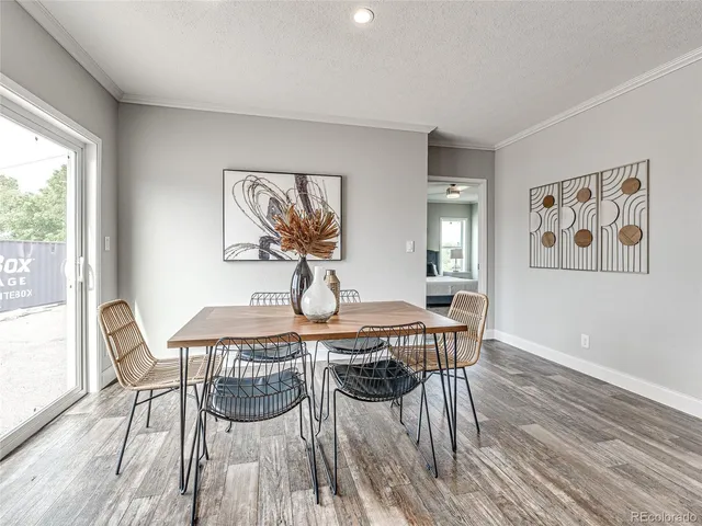 a view of a dining room with furniture window and wooden floor