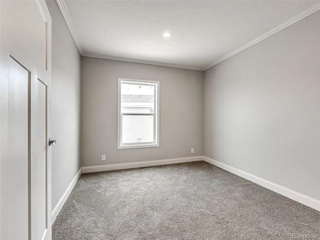 an empty room with a empty space and windows