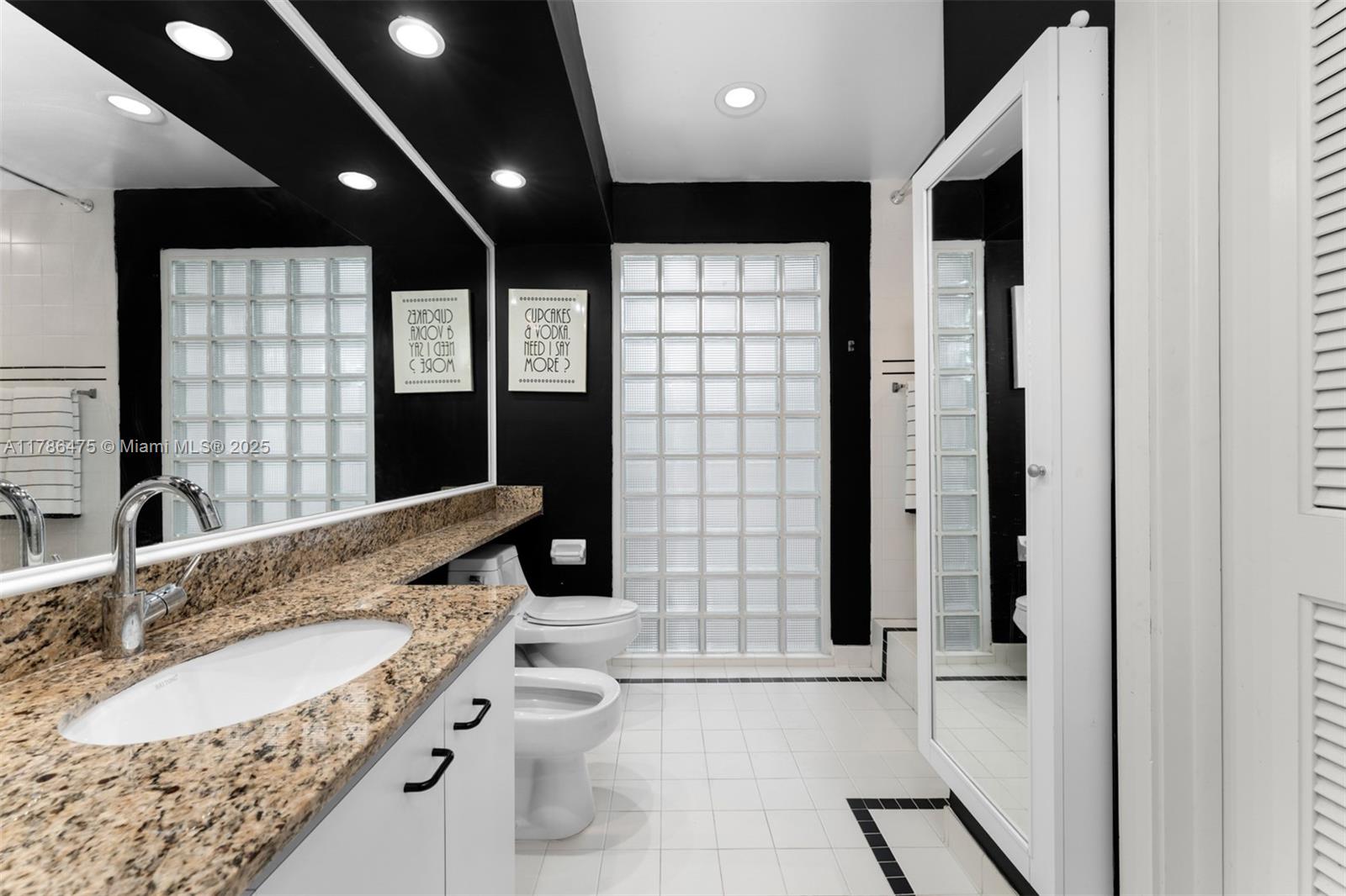 8820 Southwest 104th Street Miami, FL 33176 - Photo 22 of 44 a bathroom with a granite countertop sink toilet and shower