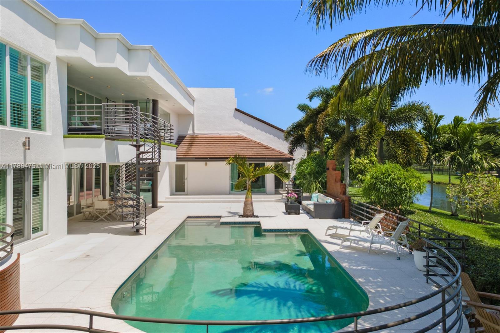 8820 Southwest 104th Street Miami, FL 33176 - Photo 35 of 44 a view of a swimming pool with a sitting area