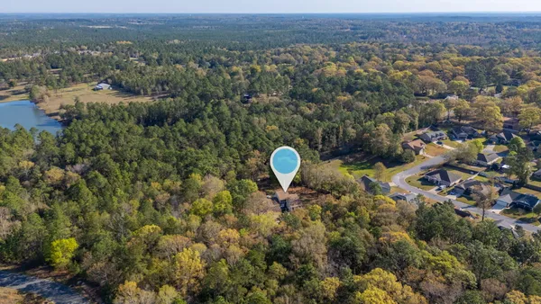 a kitchen with stainless steel appliances a sink cabinets and wooden floor