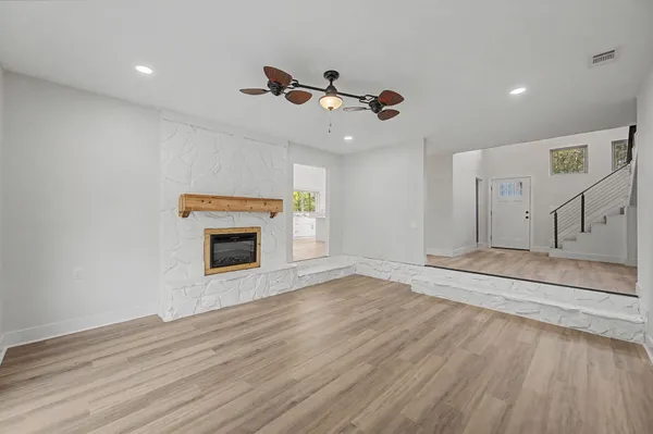 a bathroom with a glass shower door